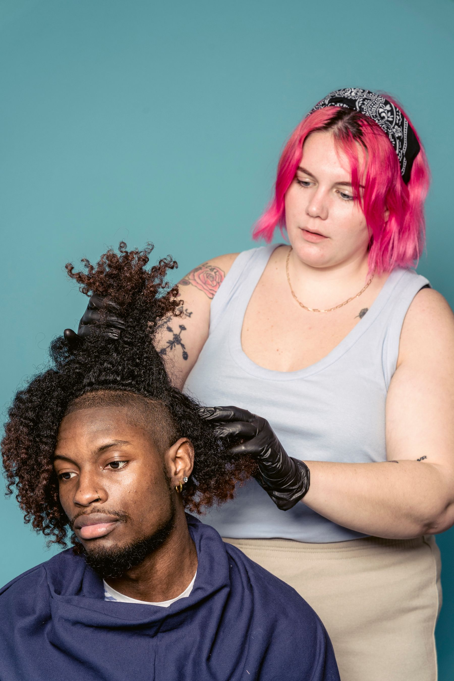 Stylist working on a client's twists